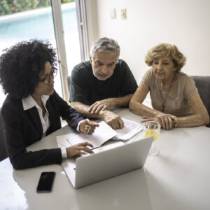 Financial advisor helping a senior couple at home